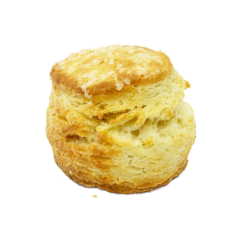 Side view of a plain looking scone topped with coarse sugar